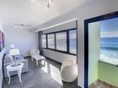 a living room with a view of the ocean at On the Wave by LovelyStay in Paul do Mar