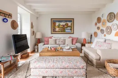 a living room with a couch and a tv at Quinta Belmonte with Private Heated Pool in Funchal in Funchal