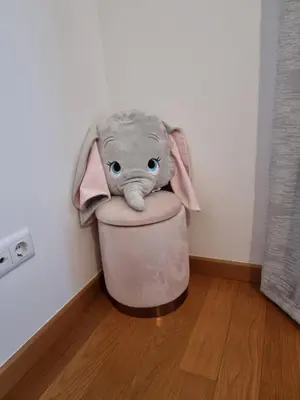 a stuffed elephant is sitting in a pot at Casa Savannah Sun in Caniço