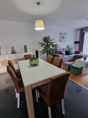 a living room with a white table and chairs at Casa Savannah Sun in Caniço