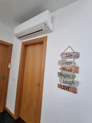 a sign hanging on a wall next to a door at Casa Savannah Sun in Caniço