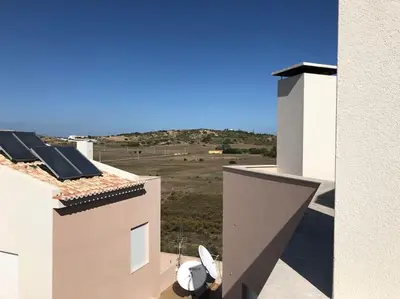 a view of a building with solar panels on the roof at Burgau 2floor appt in condominium w/ shared pool in Burgau