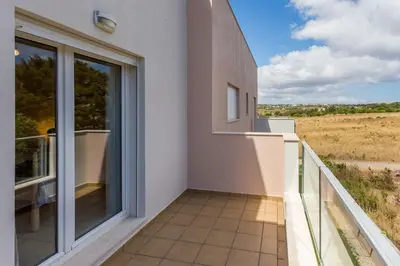 a balcony with a view of a field at Burgau 2floor appt in condominium w/ shared pool in Burgau