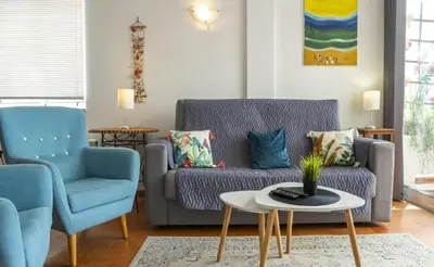 a kitchen and living room with a table and chairs at B65 - Casa Le Ferreira in Praia da Luz in Luz