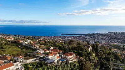 an aerial view of a city and the ocean at Casa Erbozeta by LovelyStay in Funchal