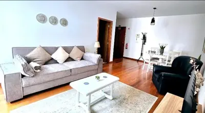 a living room with a couch and a table at Ocean Pearl Apartment W in Funchal