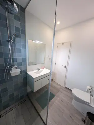 a bathroom with a sink and a toilet and a mirror at Casa Oliveira in Sagres