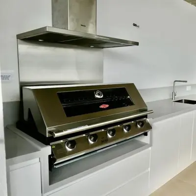 a kitchen with a stove top oven in a kitchen at Ocean view Architectural Modern Villa in Burgau