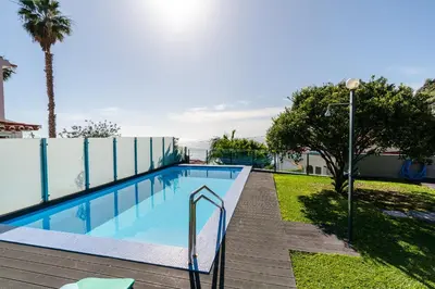 a swimming pool with aicrobialicrobialicrobialicrobialicrobialicrobial at Calheta Tangerine House in Arco da Calheta