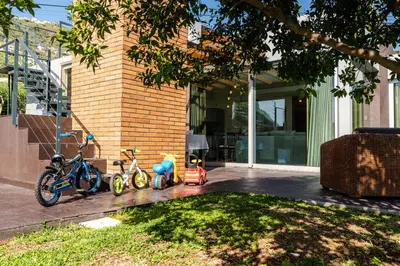 a group of three bikes parked next to a house at Calheta Tangerine House in Arco da Calheta