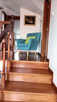 a blue chair sitting on top of a staircase at Madeira Panoramic Villa- Promoção 2 ou 3 semana in Funchal
