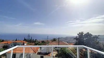 a view of the ocean from the balcony of a house at Madeira Panoramic Villa- Promoção 2 ou 3 semana in Funchal