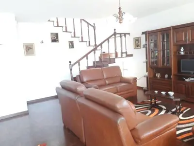 a living room with a couch and a chair at Madeira Panoramic Villa- Promoção 2 ou 3 semana in Funchal