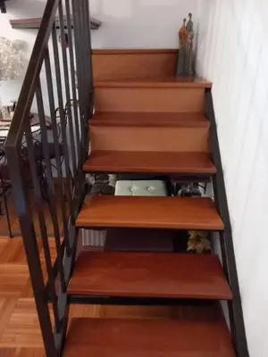 a stairwell with wooden treads at Cantinho da Maria in Funchal
