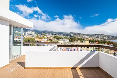 a balcony with a view of a city at Casa Branca 360 - Penthouse - By Wehost in Funchal