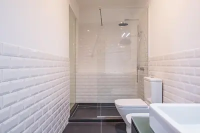 a white bathroom with a toilet and a shower at Apartament 6 - By WeHost in Funchal