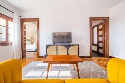 a living room with a couch and a table at Apartament 6 - By WeHost in Funchal