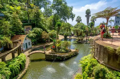 a river in a park with a bridge at Premium quiet apt Funchal seafront Oceanbreeze in Funchal