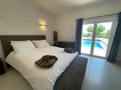 a bedroom with a bed with a towel on it at Casa Limonte in Luz