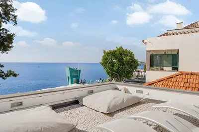 a view of the ocean from the balcony of a house at Casa Clarisse by Holiday Rental Madeira in Funchal