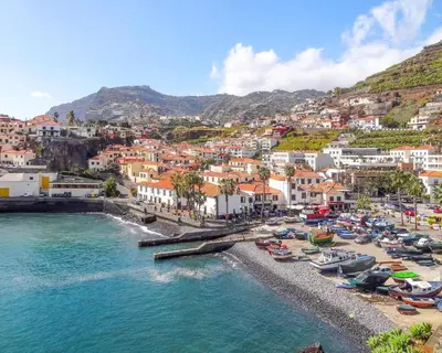 an aerial view of a beach with boats in the water at Casa Clarisse by Holiday Rental Madeira in Funchal