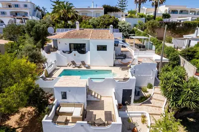 an aerial view of a house with a swimming pool at CoolHouses Algarve, Luz, 3 Bed villa, 1 bed studio, heated pool & jacuzzi, sea views, Casa Pequena in Luz