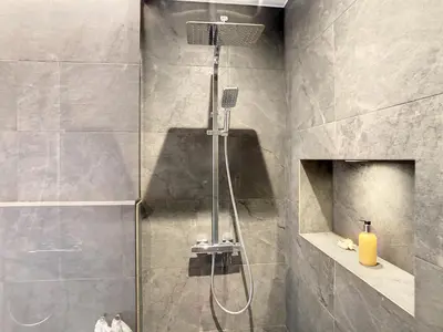 a bathroom with a shower with a shower head at Francelho 1 Apartment by LovelyStay in Ribeira Brava