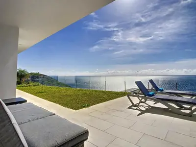 a patio with a couch and a view of the ocean at Francelho 1 Apartment by LovelyStay in Ribeira Brava