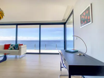a living room with a table with a laptop on it at Francelho 1 Apartment by LovelyStay in Ribeira Brava