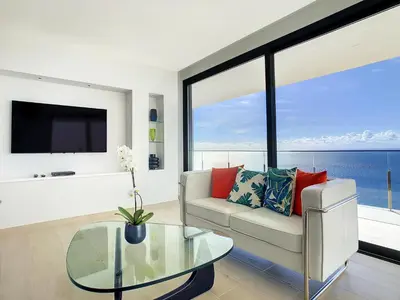 a living room with a couch and a glass table at Francelho 1 Apartment by LovelyStay in Ribeira Brava