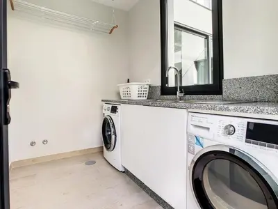 a laundry room with a washer and dryer at Francelho 2 Aparment by MHM in Ribeira Brava