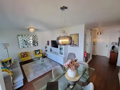 a living room with a couch and a table at Kiara's Cantinho do Mar by Rentallido in Funchal