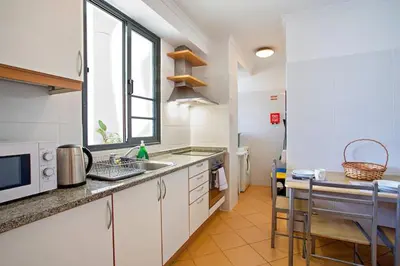 a kitchen with a sink and a counter top at MCR Funchal in Funchal