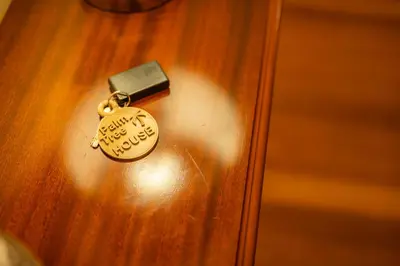 a lock on a wooden door with a key at Palm Tree House by Amazing Madeira in Câmara de Lobos