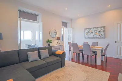 a living room with a couch and a table at Pi Houses in Funchal