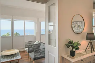 a living room with a view of the ocean at Pi Houses in Funchal