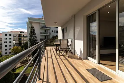 a balcony with a table and chairs on it at Barreiros Holidays by Atlântica in Funchal