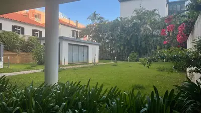 a view of a yard with a house at Sea and Sun 4 You - Jardins da Imperatriz in Funchal