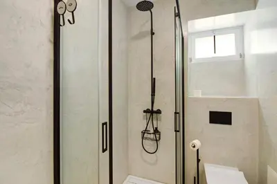 a bathroom with a sink and a mirror at Casa do Calhau in Câmara de Lobos