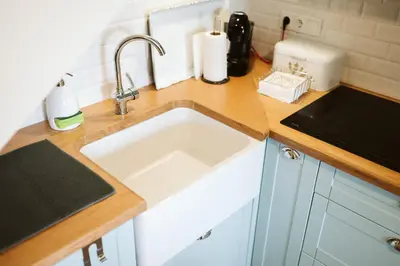 a kitchen with a sink and a counter top at Casa das Andorinhas - 1 bedroom apartment sleeps 4 in Câmara de Lobos