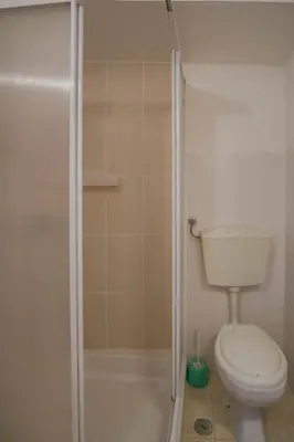 a bedroom with a bed with two towels on it at Casa dos Avózinhos, Praia da Luz in Luz