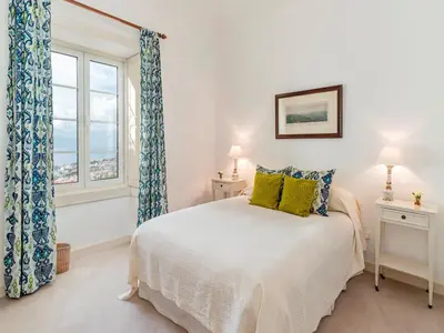 a bedroom with a bed and a window at Magnificent Funchal Villa Quinta D'alegria 4 Bedrooms Panoramic Sea View in Funchal