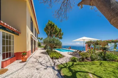 a villa with a pool and a view of the ocean at Magnificent Funchal Villa Quinta D'alegria 4 Bedrooms Panoramic Sea View in Funchal
