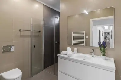 a bathroom with a toilet and a sink and a shower at Stunning Funchal Villa 3 Bedrooms Vila Da Portada Panoramic Sea Views in Funchal