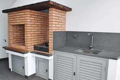 a kitchen with a sink and a brick wall at Stunning Funchal Villa 3 Bedrooms Vila Da Portada Panoramic Sea Views in Funchal