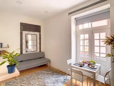 a living room with a couch and a table at FX City Life by LovelyStay in Funchal