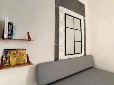 a wall with a window and a shelf at FX City Life by LovelyStay in Funchal