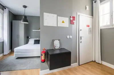 a bedroom with a bed and a fire hydrant next to a door at Amazing Old Town - Apartments by SBH in Funchal
