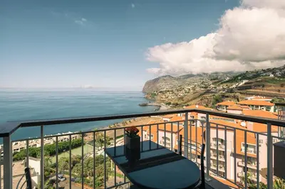 a balcony with a view of the ocean at Sunny Bayhill with swimming pool in Funchal