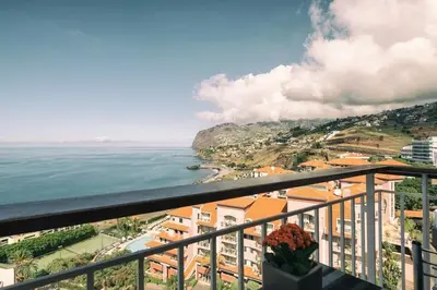 a view of the ocean from a balcony at Sunny Bayhill with swimming pool in Funchal